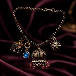 Vintage-Style Antique Gold Jhumka Charm Bracelet – Elephant, Sunburst, and Cryst
